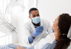 Dentist and their patient talking