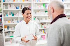 Pharmacist serving customer