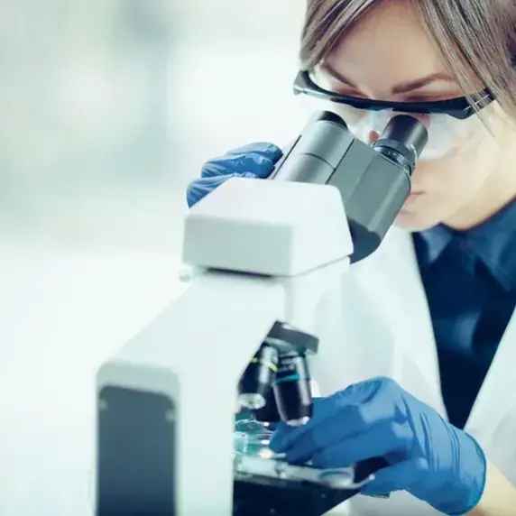 Scientist using microscope Scientist using microscope